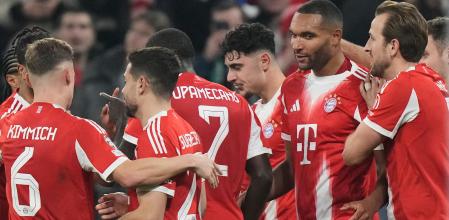 Bayern Munich players celebrate after Bayern's Jonathan Tah, second right, scored his side's third goal during the Champions League opening phase soccer match between FC Bayern Munich and Sporting CP in Munich, Germany, Tuesday, Dec. 9, 2025. (AP Photo/Matthias Schrader)