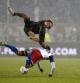 HSV's Miro Muheim, bottom, and St. Pauli's Elias Saad vie for the ball during their German Bundesliga 2 soccer match at the Millerntor Stadium in Hamburg, Germany Friday, Dec. 1, 2023.  (Marcus Brandt/dpa via AP)